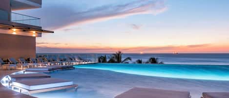 2 outdoor pools, sun loungers, lifeguards on site