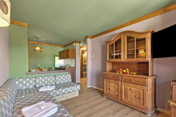 Family Apartment, Multiple Bedrooms, Mountainside (Sises Lodge - 27D Sestriere) | Living area | 21-inch flat-screen TV with digital channels, TV