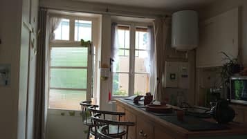 Microwave, oven, stovetop, dining tables