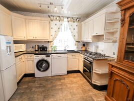 Fridge, electric kettle, toaster, cookware/dishes/utensils