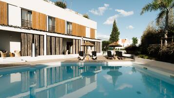 Outdoor pool, pool umbrellas, pool loungers