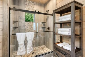 Combined shower/bathtub, towels, toilet paper