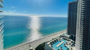 A high-rise hotel with a pool and beach view. - Amazing Ocean Views at LYFE Resort @rent4us (Hollywood)