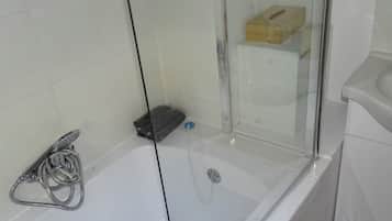 Combined shower/tub, hair dryer, towels, soap