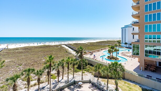 A resort with a pool, beach access, and a view of the ocean. - Tidewater 307 | Perfect Location, Magnificent Views | Indoor/Outdoor Pools (Orange Beach)