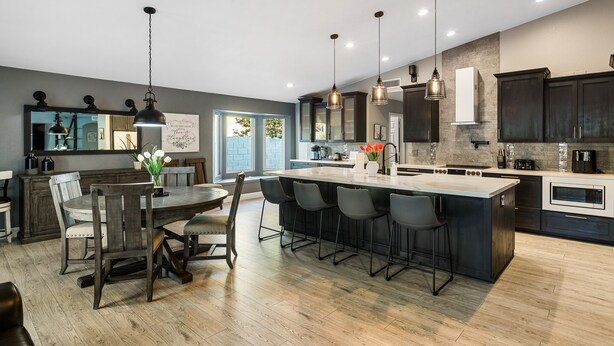 A modern kitchen with a central island, bar stools, and pendant lighting. - Scottsdale Gem - Remodeled, Pool, Hot Tub (Scottsdale)