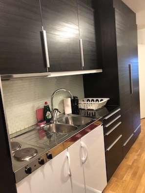 Enjoy cooking in this well-equipped kitchen with a stovetop and double sink.