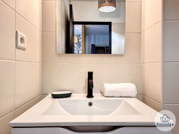 Shower, hair dryer, towels, soap