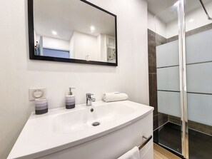 Shower, hair dryer, towels, soap