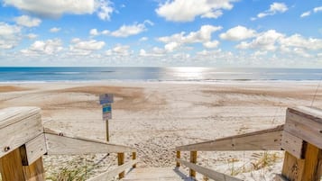 On the beach, sun loungers, beach towels