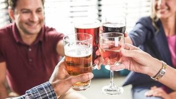 A group of people toasting with beer glasses.