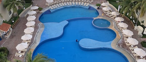 2 outdoor pools, open 8:00 AM to 8:00 PM, pool umbrellas