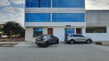 Hotel GoldenSky features a modern design with a flat roof and large windows.