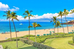 On the beach, sun loungers, beach towels