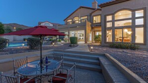 A modern house with a patio, outdoor seating, and a swimming pool. - LUX Near Golf & Trails: Pvt POOL/Spa, Wood FP, Game Tables, TVs All BRs, EV Charger (Mesa)
