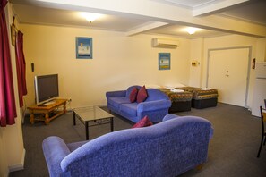 Family Apartment, 1 Bedroom | Living area | TV, DVD player - Cherry Lane Apartments (Bright)