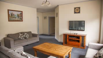 Family Apartment, 3 Bedrooms | Living area | TV, DVD player