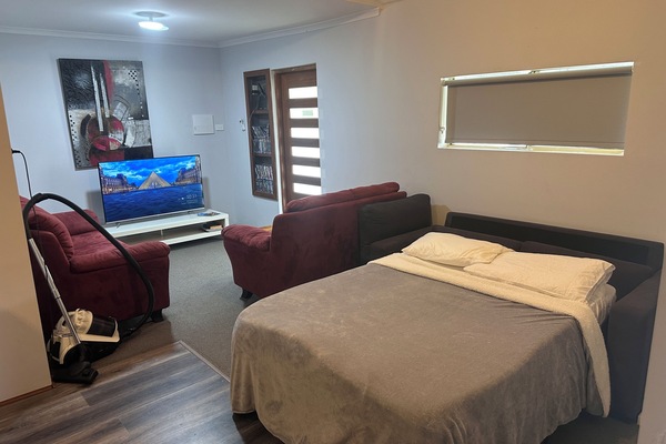 Fold out couch bed in open lounge area