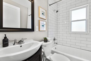 Combined shower/bathtub, hair dryer, towels - 4 Bedroom Bungalow in the "Heart of Metro Detroit" (Center Line)