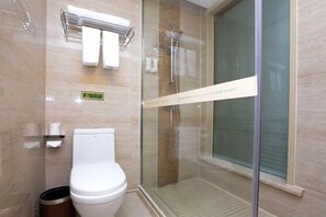 A modern bathroom with a glass-enclosed shower, a toilet, and a towel rack. - Vienna International Hotel Nanning Wuyi Fude (Nanning)