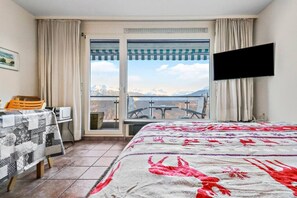 1 bedroom, desk, iron/ironing board, travel crib