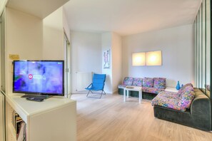Standard Apartment, Multiple Bedrooms, 2 Bathrooms (Casa Emma With Sea Glimpse) | Living area | 21-inch TV with cable channels