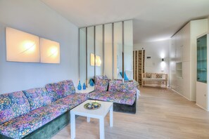 Standard Apartment, Multiple Bedrooms, 2 Bathrooms (Casa Emma With Sea Glimpse) | Living area | 21-inch TV with cable channels