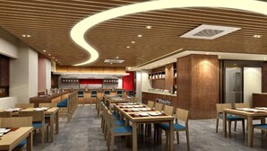 A modern restaurant with wooden tables and chairs, a curved ceiling design, and a kitchen area in the background. - Busan Connect Ocean Hotel (Busan)