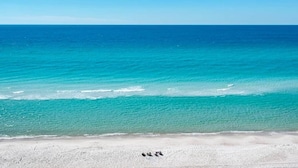 A beach with clear turquoise water and a sandy shore. - Beautiful Beachfront Condo, Free Beach Ser., Pool, Great Balcony Views! (panama city beach)