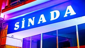 A building with a sign that reads "SINADA". - Sinada Otel (Eskisehir)