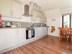 Fridge, electric kettle, cookware/dishes/utensils