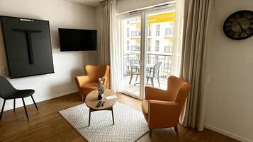 Monolocale comfort | Area soggiorno | TV a schermo piatto 42 pollici con canali via cavo, TV, Netflix