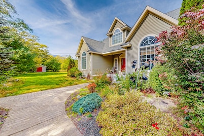 Lovely home with water view, hot tub, fireplace, & washer/dryer