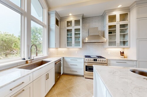 Stunning oceanfront home with pool, private boardwalk, decks, & elevator