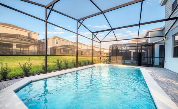 Enjoy a refreshing swim in our pool surrounded by a tranquil neighborhood view.