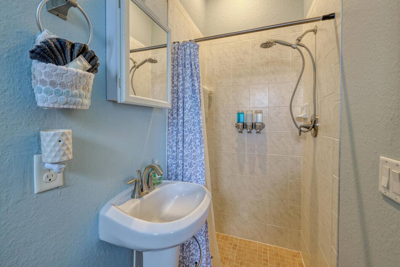 Full bath with shower is accessible from bedroom w/king bed and pool area