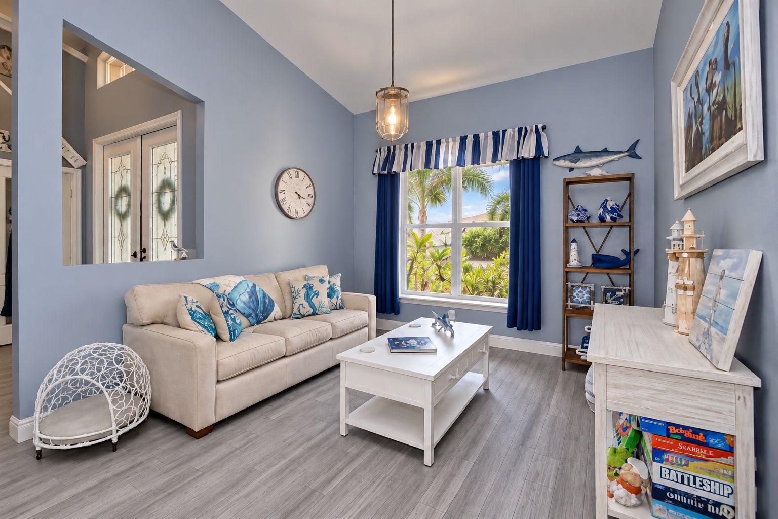 A living room with a sofa, coffee table, and decorative items.