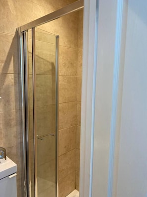 Studio, 1 Queen Bed | Bathroom | Shower, hair dryer, towels, soap
