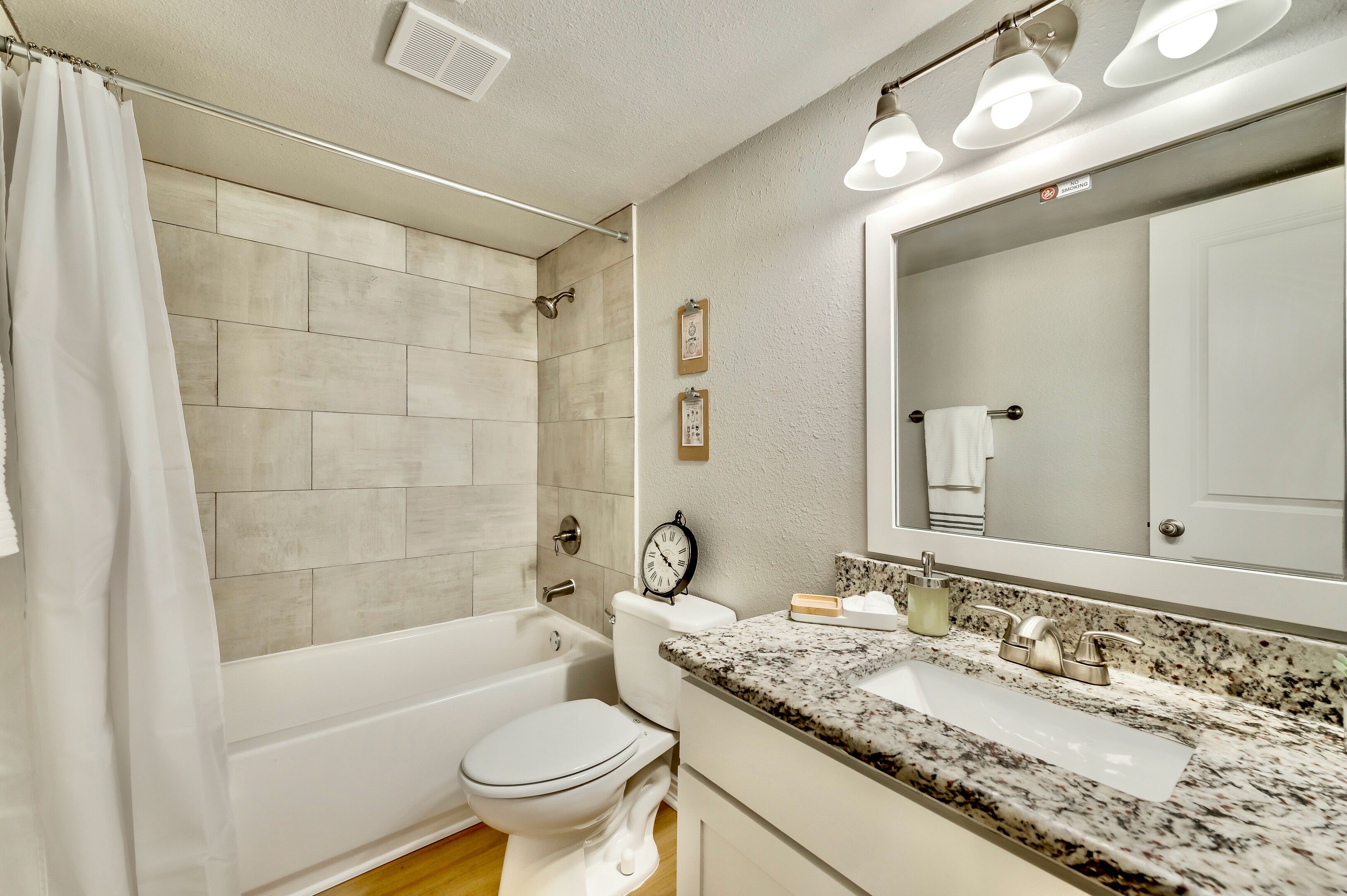Combined shower/tub, hair dryer, bidet, towels