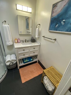 Shower, hair dryer, towels, soap