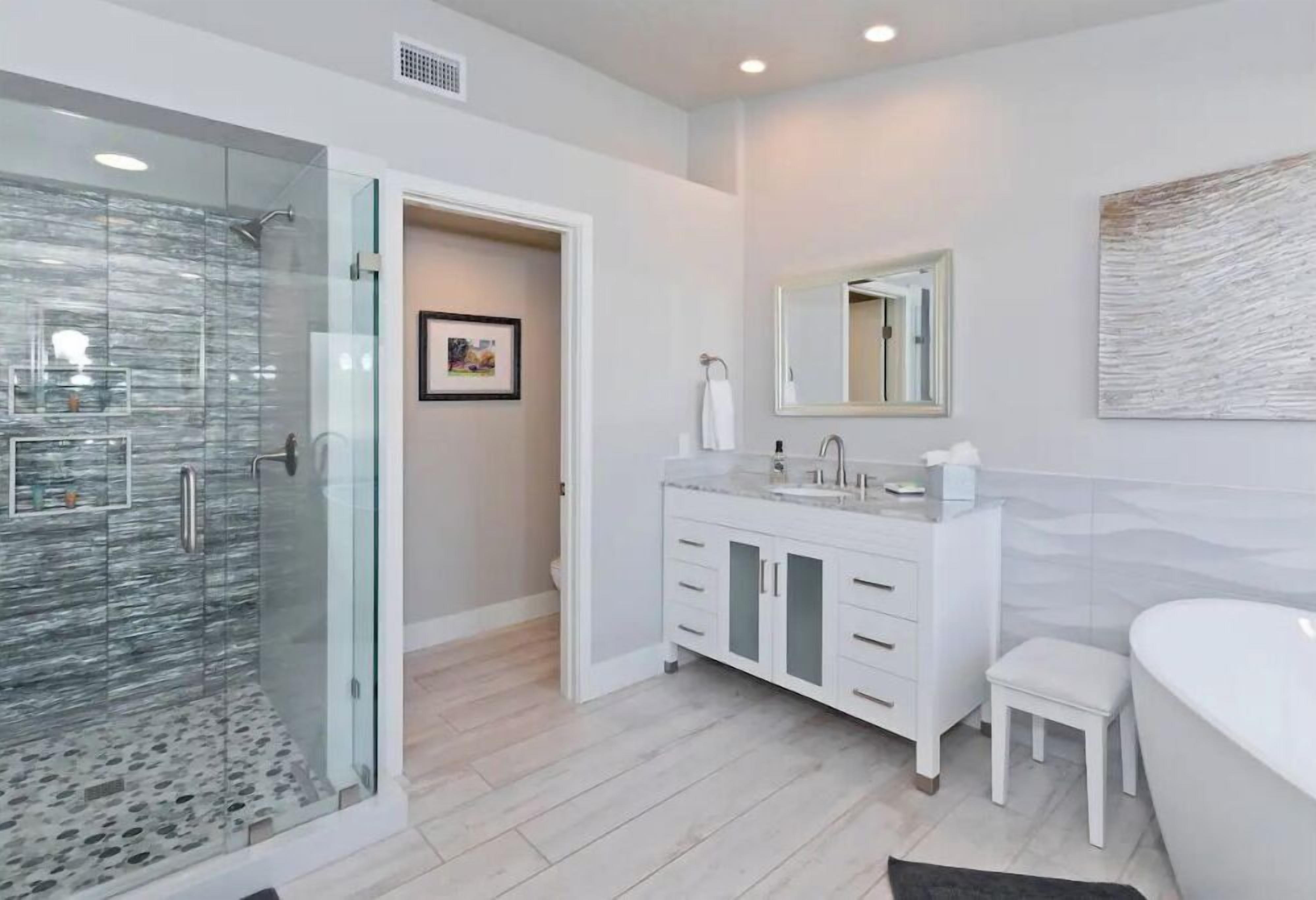 Bathtub, hair dryer, towels, soap