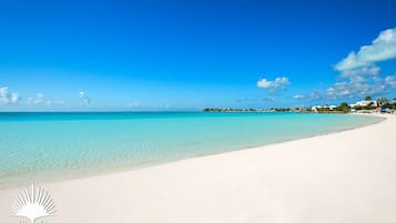 On the beach, sun loungers, beach towels