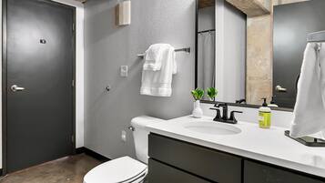 Combined shower/tub, hair dryer, towels, soap