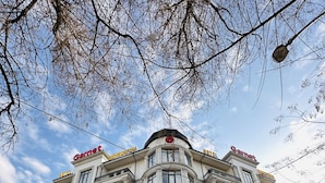 A large, historic building with multiple balconies and large windows, likely a hotel or public building. - Garnet Hotel (Tashkent)