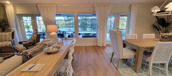 Golf cart distance to WEF! Charming 3 bedroom waterfront home with heated pool.