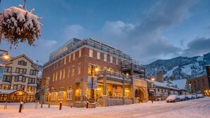 A hotel with a brick facade, multiple windows, and a balcony. - Sleek Park City Main St Rental: Steps to Ski Lift (Park City)