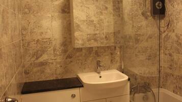 Apartment, 1 King Bed | Bathroom | Combined shower/bathtub, deep-soaking bathtub, hair dryer, towels