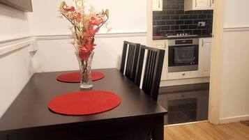 Apartment, 1 King Bed | Private kitchen | Fridge, microwave, oven, stovetop