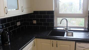 Apartment, 1 King Bed | Private kitchen | Fridge, microwave, oven, stovetop