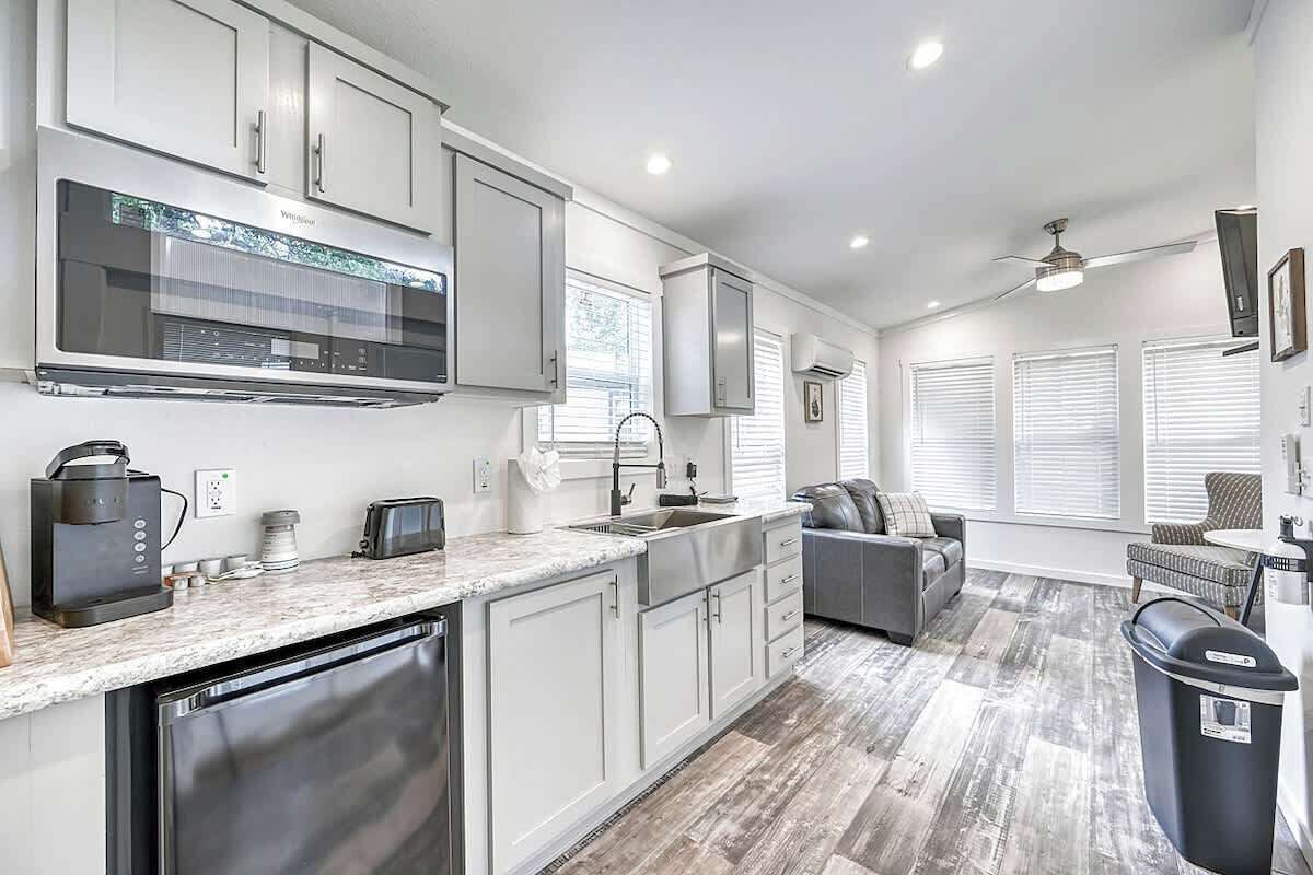 Fridge, microwave, coffee/tea maker, cookware/dishes/utensils